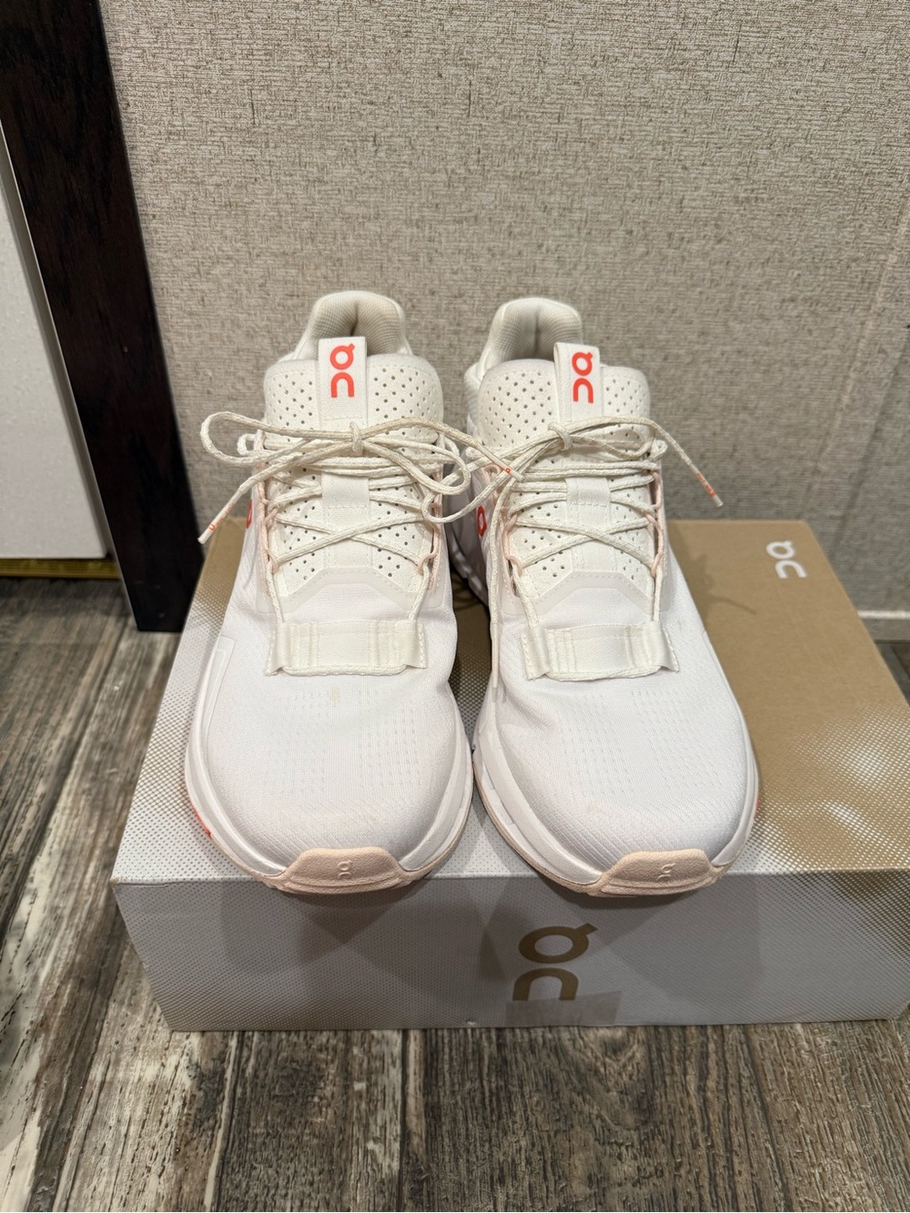 On Running women's sneakers in white and light pink accents
